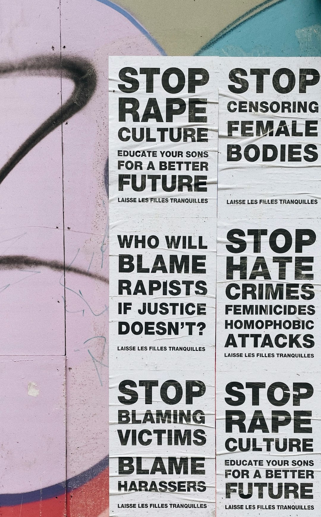 a-bunch-of-stickers-on-the-side-of-a-wall-fr-85x9ksg0