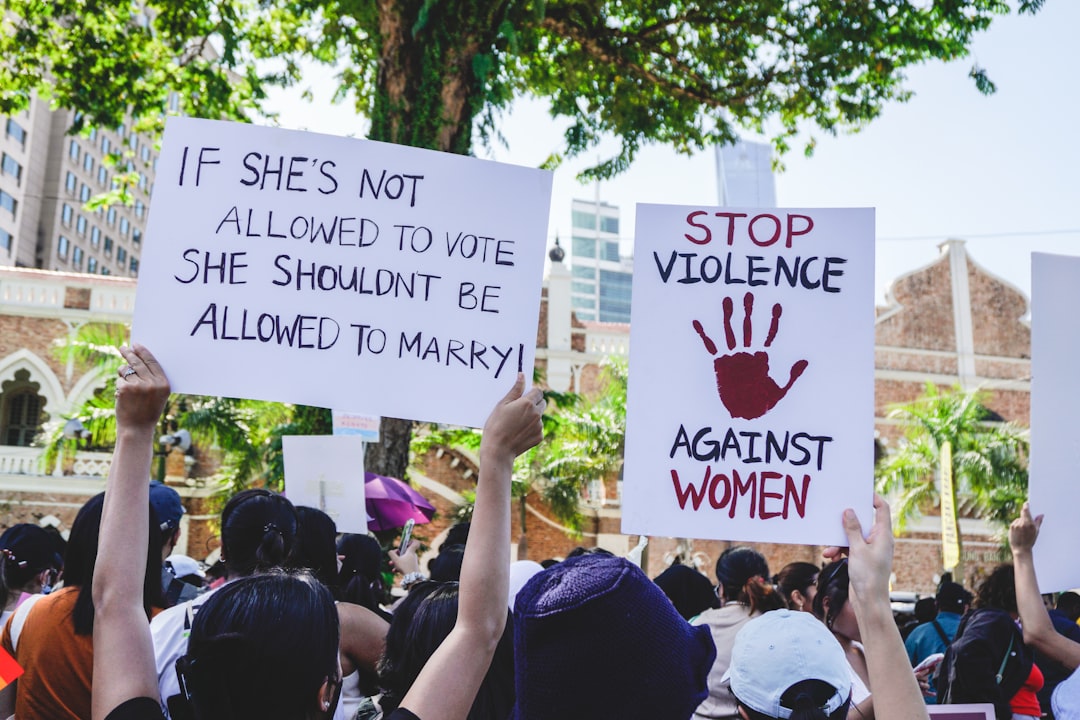 Placards during the Womens March MY in Kuala Lumpur, Malaysia, on 12th March, 2023. One of the placards says, If shes not allowed to vote, she shouldnt be allowed to marry!, while the other says Stop violence against women. Child marriage laws in Malaysia allows adult men to take underage girls as wives.